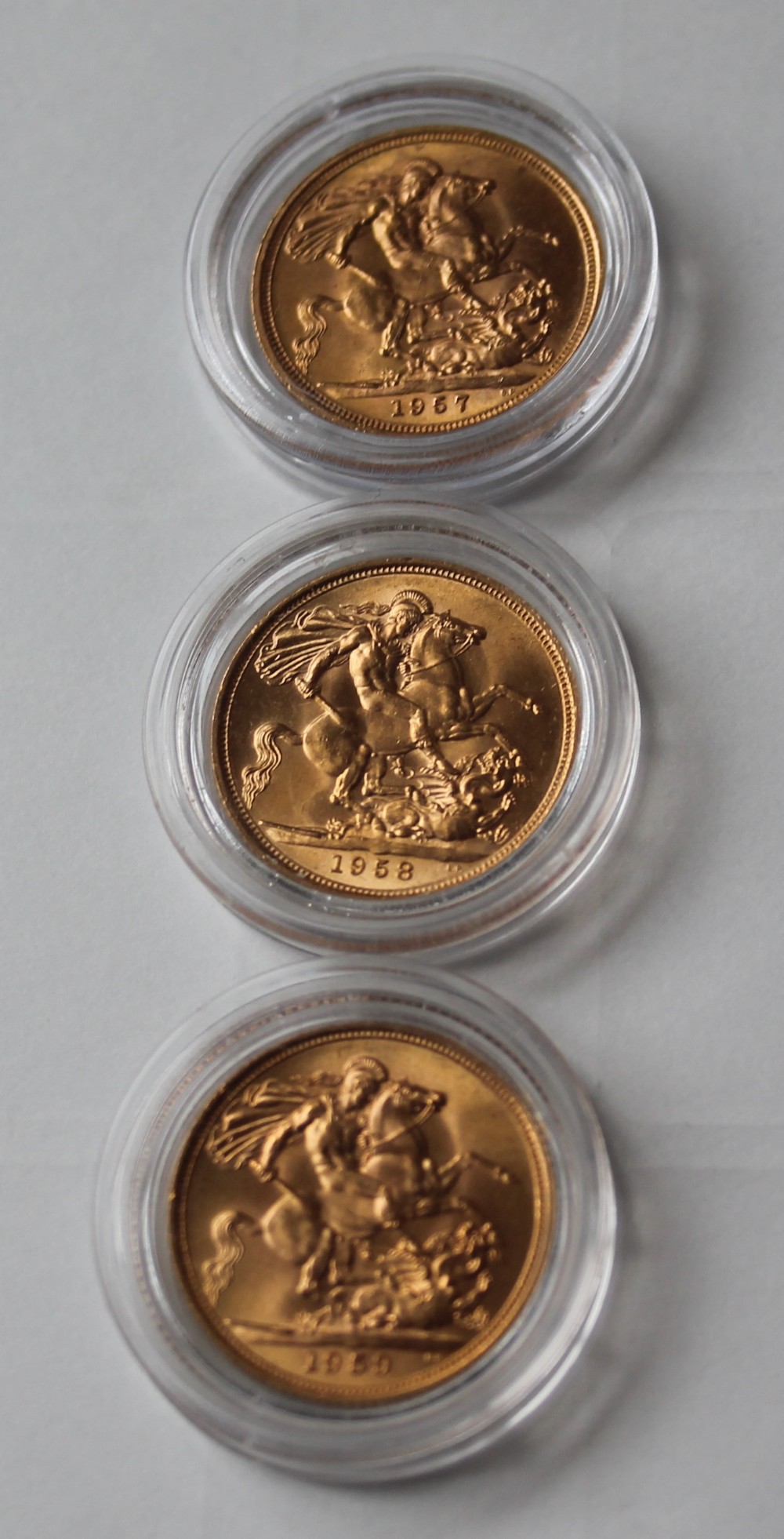 GOLD SOVEREIGNS - three 22ct gold full sovereigns being in a date run to include 1957,