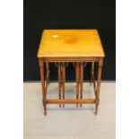 WOODEN NEST - a wooden square shaped nest with two smaller folding round side tables stored by