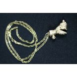 NECKLACE AND PENDANT - a 9ct poodle pendant with pink gemstone eyes on a 9ct anchor chain. 1" high.