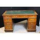 DESK - a late Victorian kneehole desk - mahogany with replaced leather top. (Handles in drawer.