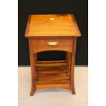 SIDE TABLE - a wooden side table featuring a drawer. Measures 27¼"x17"x17".