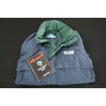 ERIC CLAPTON - an Eric Clapton 1998 US tour winter coat/jacket in green and blue (L) and a North