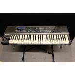 CASIO KEYBOARD AND STAND - a Casio HT-30