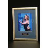 KYLIE MINOGUE - a framed Kylie Minogue autographed photograph featuring plaque "Original autograph