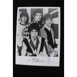 THE WHO - a signed photograph of the band during their early years featuring autographs of Pete