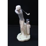 LLADRO - a Lladro figure of a golfer taking a strike at the ball, measures 29cm tall.