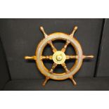 NAUTICAL - SHIPS WHEEL - a Sampson Lawrence oak ships wheel, with brass boss, c.193060cm diameter.