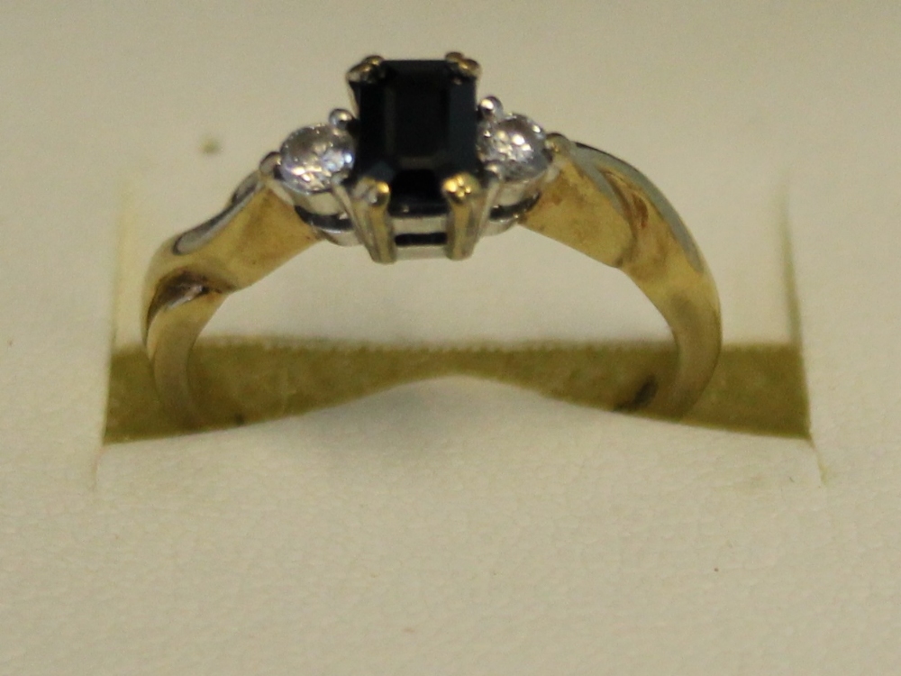 JEWELLERY - a 9ct emerald cut Sapphire with two Diamonds on the shoulder, weight of the ring is 2. - Image 2 of 2