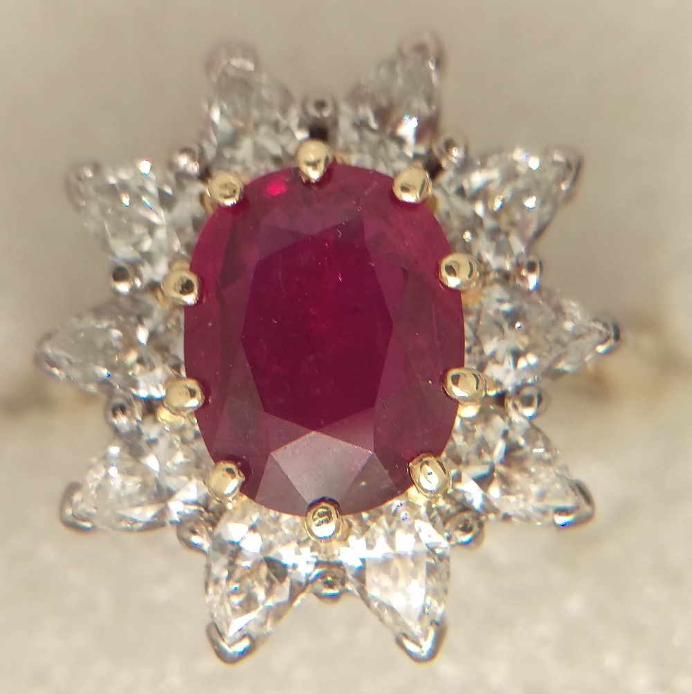 RUBY CLUSTER RING - a Ruby & Diamond cluster ring set in 18ct gold,