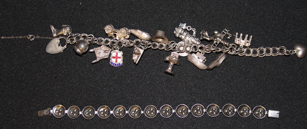 JEWELLERY - a silver charm bracelet containing 15 charms of which 10 are silver (total weight of - Image 2 of 2