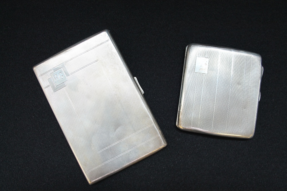 SILVER - two Birmingham silver cigarette cases (1930 & 1937), weight 265 grammes.