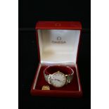 WATCH - OMEGA - a gents Omega automatic wrist watch, worn bracelet with Omega clasp, original box,