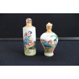 SNUFF BOTTLES - 2 oriental snuff bottles with stoppers, the largest size is 10.