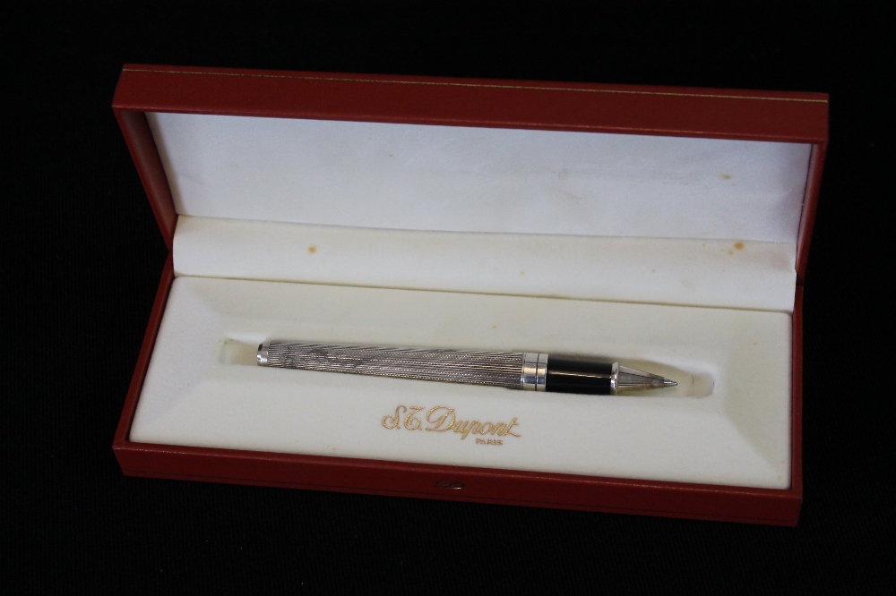 STERLING SILVER DUPONT - an 'Olympio' solid silver rollerball pen with original box and paperwork