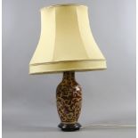 A pottery based tablelamp with stylized