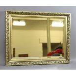 A gilt framed bevel edge rectangular wal