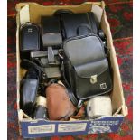 A collection of assorted cased cameras a