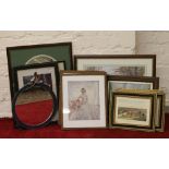 A collection of framed pictures and prin