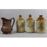 Three advertising stoneware flagons alon