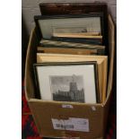 A box of assorted framed prints includin