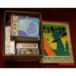 A box of games including vintage example