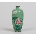 A Japanese Meiji period high shouldered cloisonne vase. Pistachio ground and decorated with peonies,