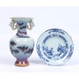 A small eighteenth century Chinese dish painted in underglaze blue with a landscape along with a