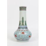 A Chinese Kangxi (1644-1722) Doucai baluster vase. The bulbous base is enamelled with Ming style