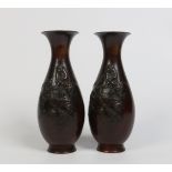 A pair of Japanese bronze baluster mantel vases. With overlay decoration each depicting three