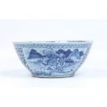 A Chinese nineteenth century punch bowl. Painted in underglaze blue with a pair of landscape