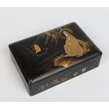 A twentieth century Chinese lacquered papier mache box. Decorated to the cover in gilt with a seated