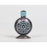 A Persian enamelled silver snuff bottle with threaded cover. Of flattened circular form, blue ground