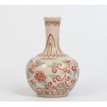 A twentieth century Chinese Ming style doucai bottle vase, 21cm. Condition Report. To be used as a