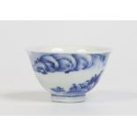 A nineteenth century Japanese teabowl with everted rim and painted in underglaze blue with a