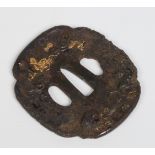 A Japanese antique iron tsuba. With silver and gold overlay decoration depicting a dragon and a