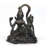 An Antique Eastern bronze figure group of a seated male and female deity, 11.5cm high. Condition