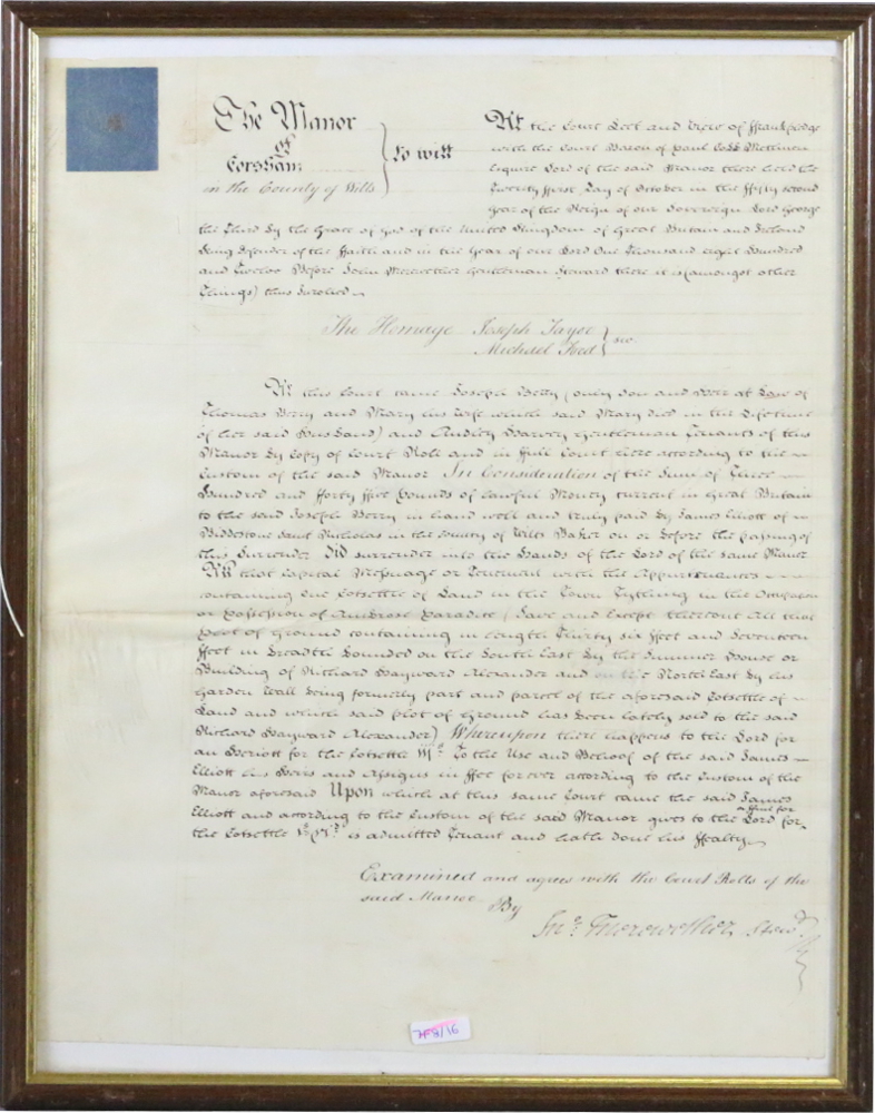 A framed handwritten legal document on v