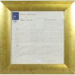 A gilt framed handwritten legal document