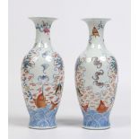 A pair of Chinese Wucai baluster mantel vases. Painted with carp and fruiting trees. Underglaze four