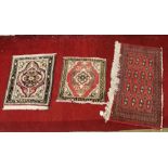 Three old hand knotted wool rugs each wi