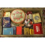 A box of assorted vintage advertising ti