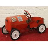 A childs tinplate pedal car.