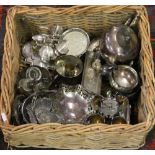 A basket containing assorted silver plat