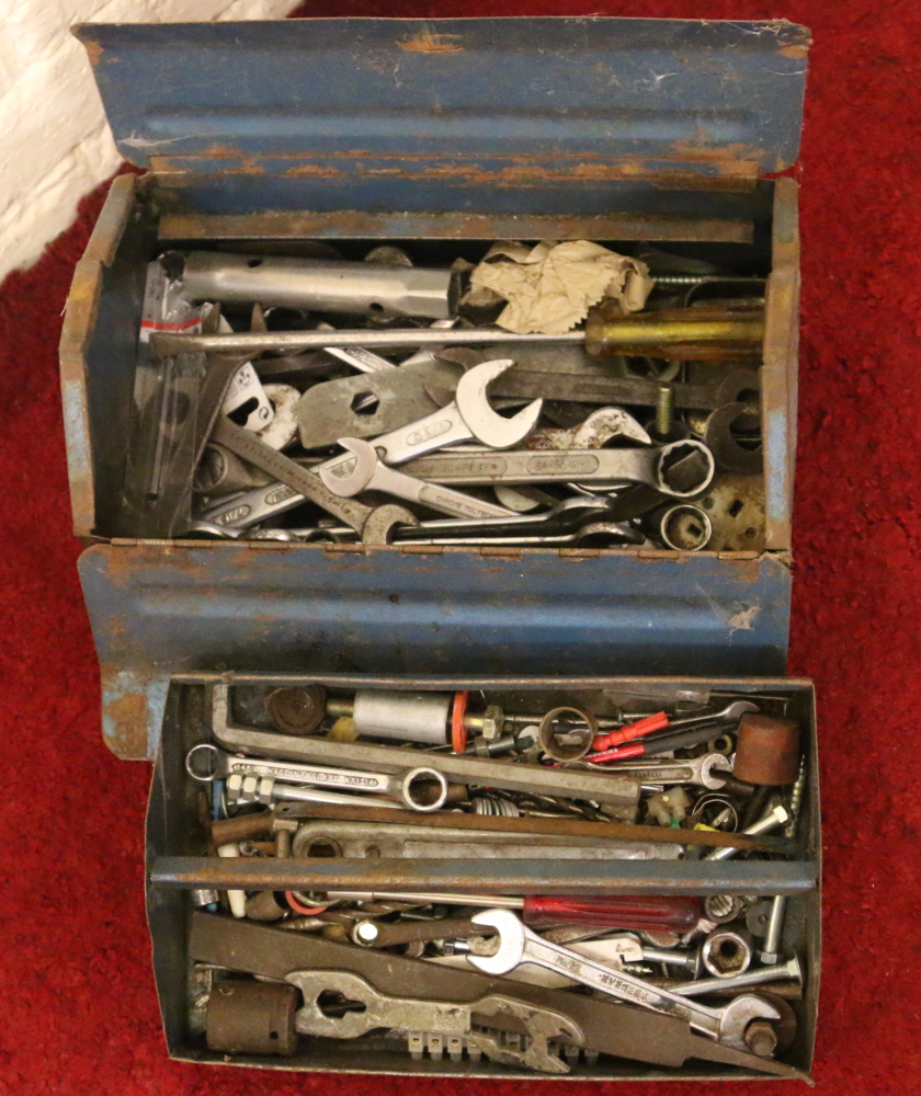 A metal tool box and contents of tools.