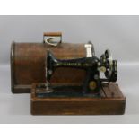 An oak cased Singer sewing machine.