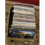 A box of L.P records rock, pop and easy