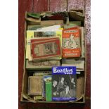 A box of assorted ephemera and books to