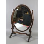 A Victorian mahogany framed mirror on stand.