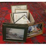 A box of various framed prints.