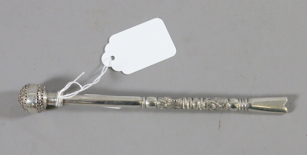 An unusual Eastern white metal straining straw.